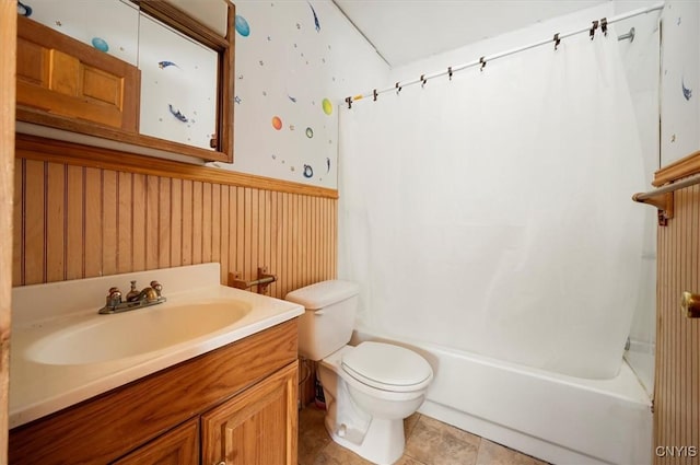 full bathroom with shower / tub combo with curtain, vanity, toilet, and tile patterned floors