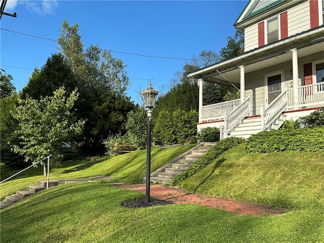 view of yard with covered porch