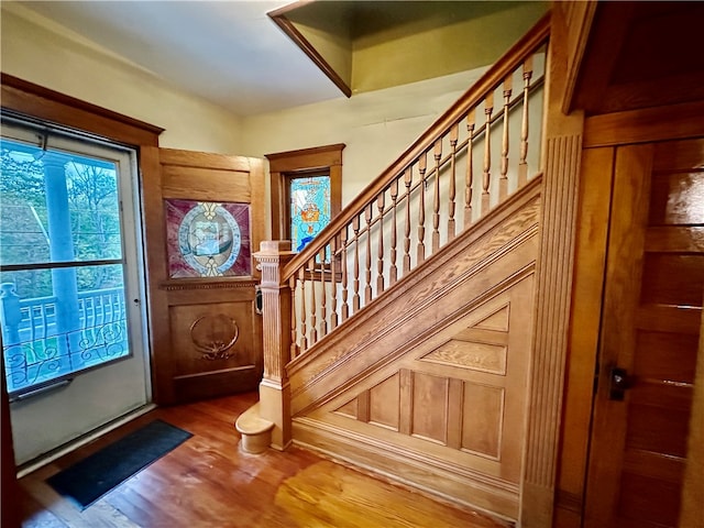 foyer entrance with hardwood / wood-style flooring