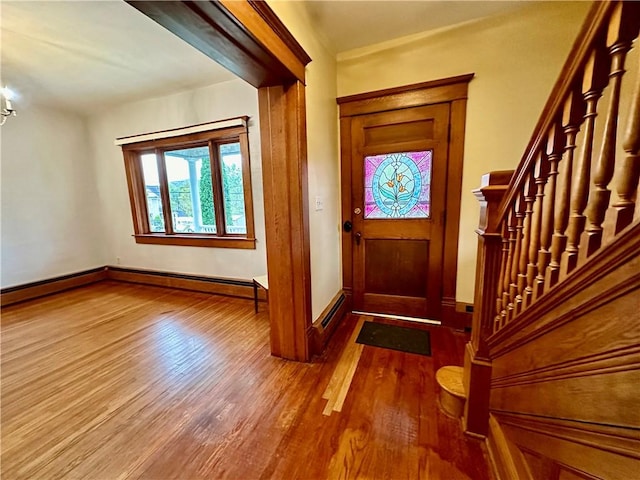 247 W Corydon St, Bradford-Town, PA 16701 - foyer with baseboard heating, baseboards, and wood finished floors