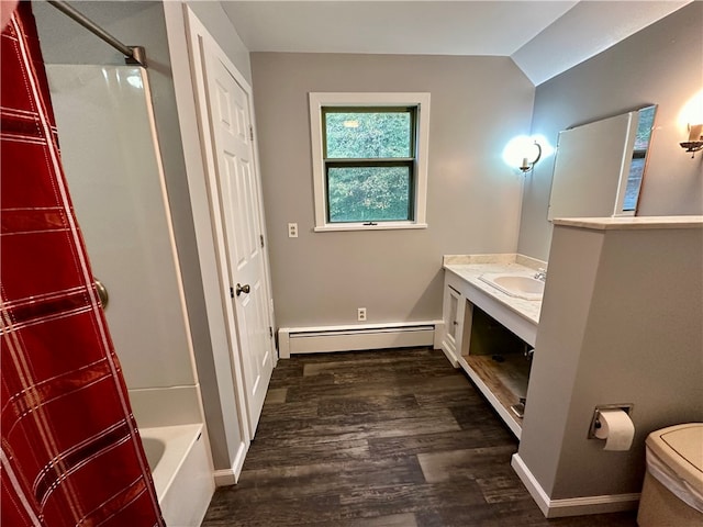 full bathroom with vanity, toilet, baseboard heating, shower / bathtub combination, and hardwood / wood-style floors