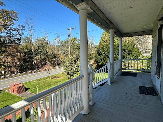 wooden deck featuring covered porch