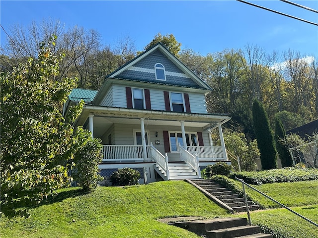 view of front of house featuring a front lawn and a porch