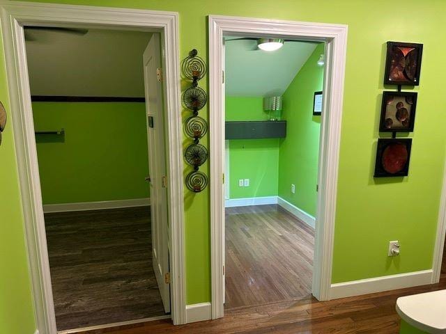 hallway with dark hardwood / wood-style floors