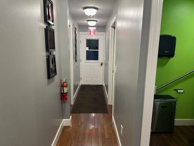 hall with dark hardwood / wood-style floors