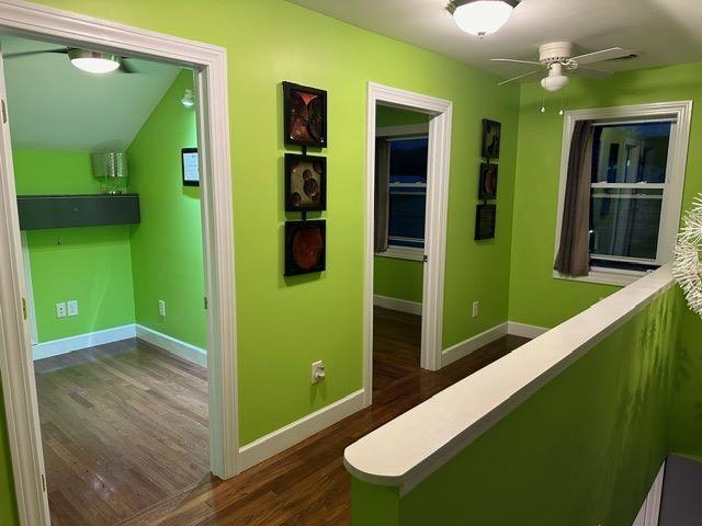 hall with dark wood-type flooring