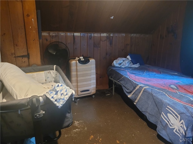 bedroom with wood walls