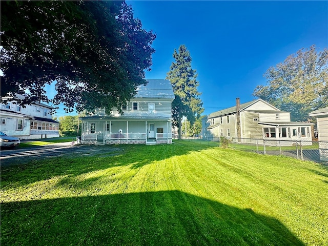 view of yard featuring covered porch