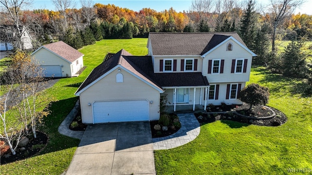 view of front of property featuring a front yard and a garage