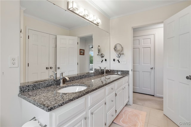 bathroom with tile patterned floors, vanity, and crown molding