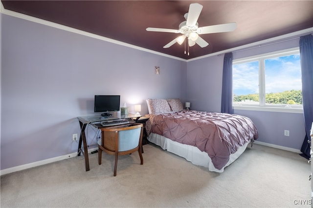 bedroom with ceiling fan, light colored carpet, and crown molding