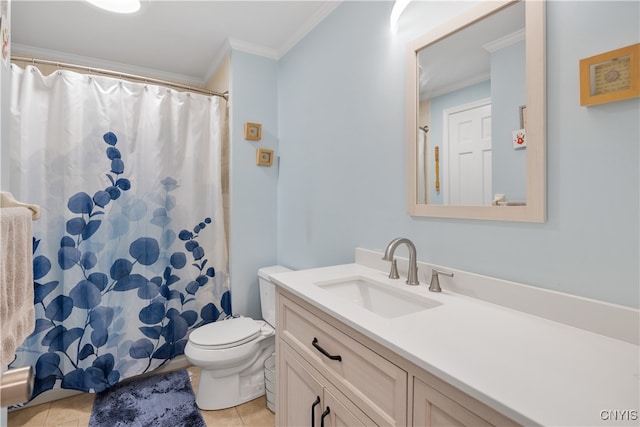 bathroom with ornamental molding, vanity, toilet, and tile patterned floors