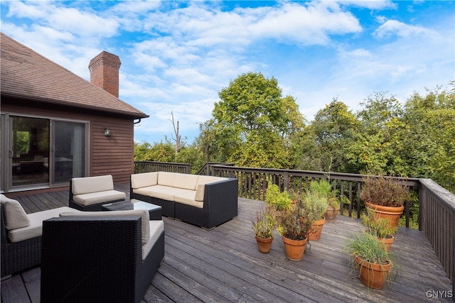 wooden deck with outdoor lounge area