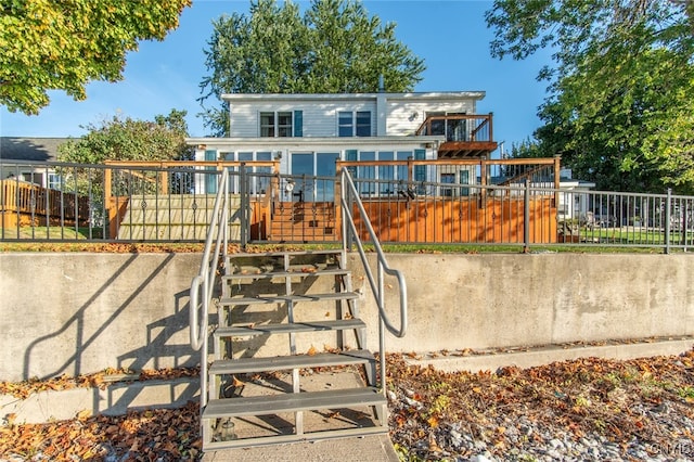 view of playground featuring a wooden deck