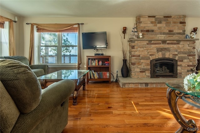 living room featuring hardwood / wood-style floors and a fireplace