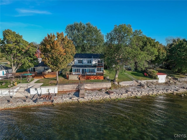 back of house featuring a water view