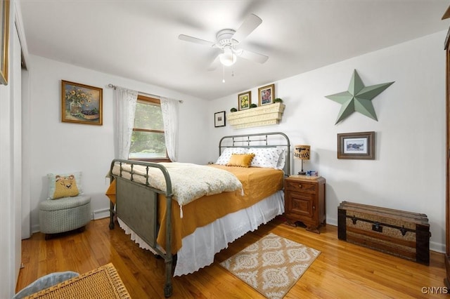 bedroom featuring ceiling fan and light hardwood / wood-style floors