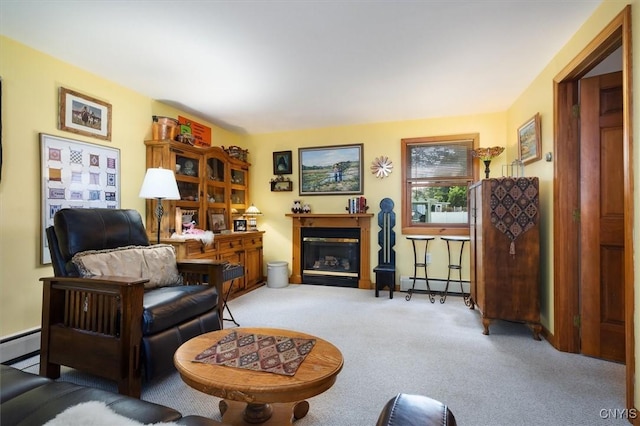 sitting room with light carpet and a baseboard radiator