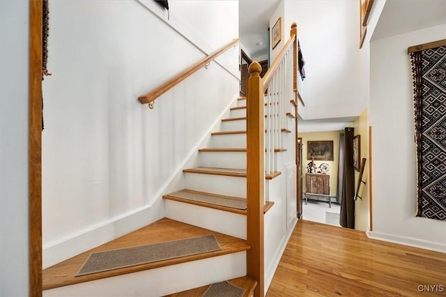 stairway featuring hardwood / wood-style floors