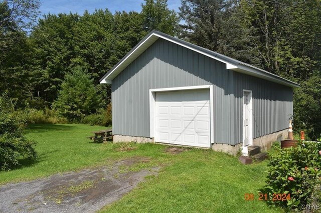 garage featuring a yard