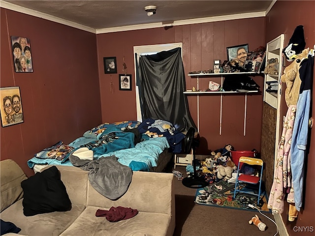 bedroom featuring carpet floors, wooden walls, and ornamental molding