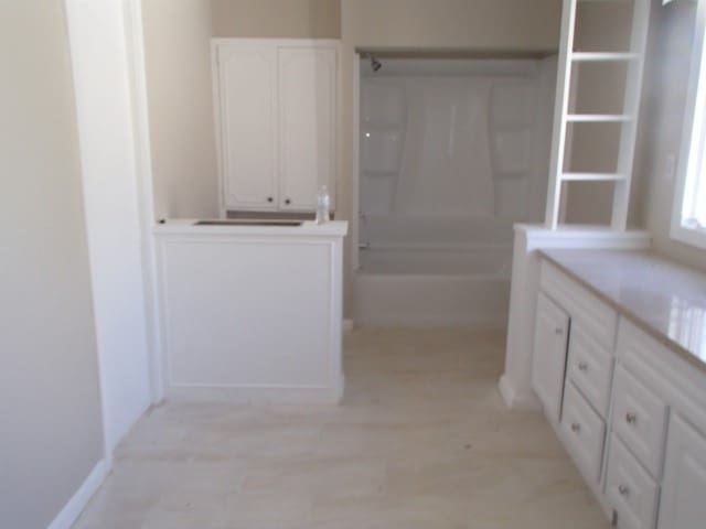 bathroom featuring independent shower and bath, hardwood / wood-style flooring, and vanity