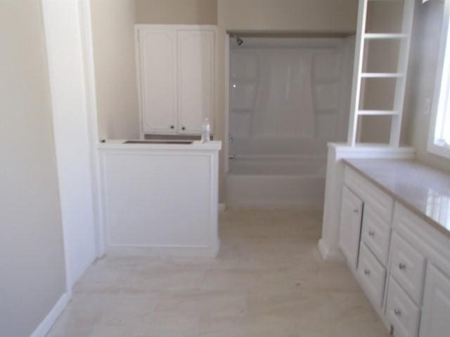 full bath featuring tub / shower combination