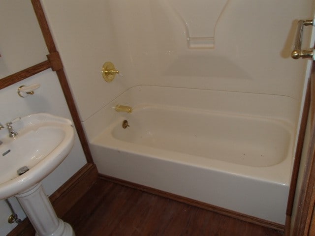 bathroom with hardwood / wood-style floors