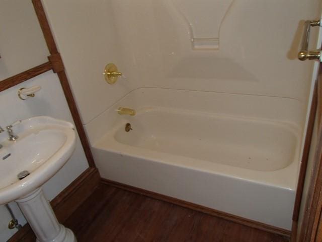 full bathroom featuring wood finished floors