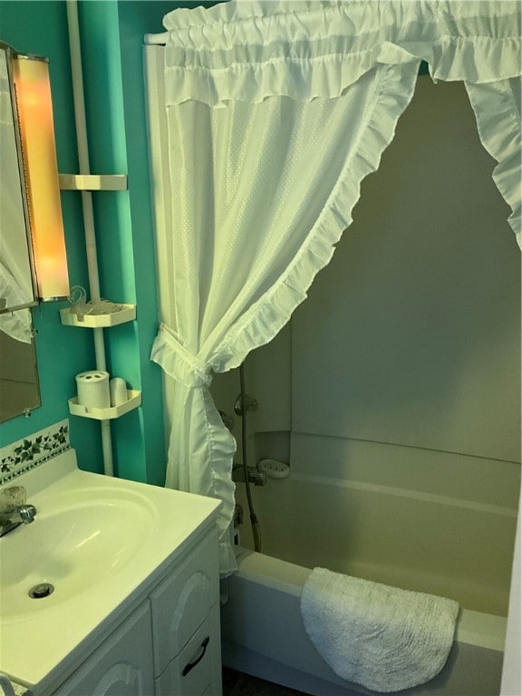 bathroom with vanity and shower / bathtub combination with curtain