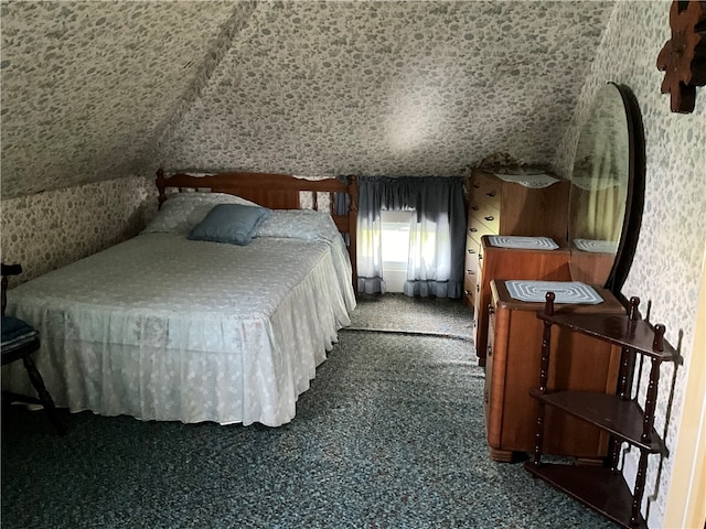 bedroom featuring dark carpet and lofted ceiling