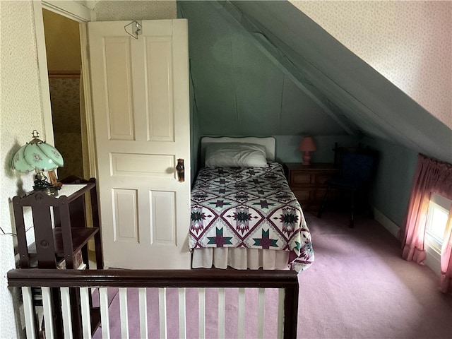 carpeted bedroom featuring lofted ceiling