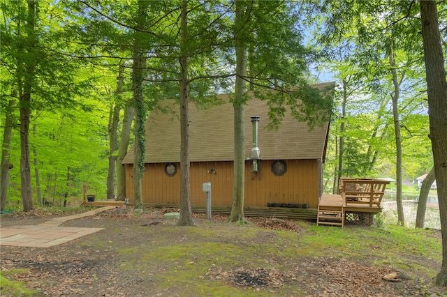 view of side of home with a deck