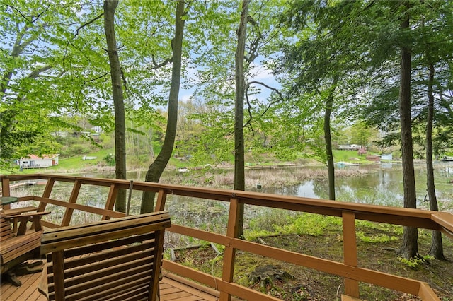 wooden deck with a water view