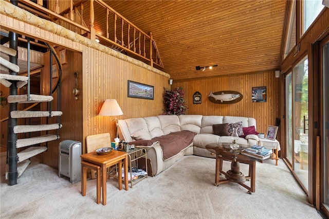 living room with high vaulted ceiling, wooden walls, wooden ceiling, and carpet floors