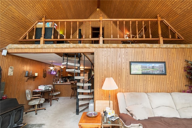 living room featuring wooden walls, vaulted ceiling, wooden ceiling, and carpet flooring