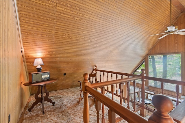 interior space featuring wooden ceiling, wooden walls, and vaulted ceiling