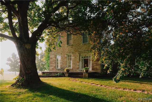 5138 Lower Mountain Rd, Cambria, NY 14094 - view of front facade with stone siding and a front yard