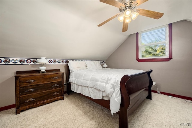 bedroom with ceiling fan, carpet floors, and lofted ceiling