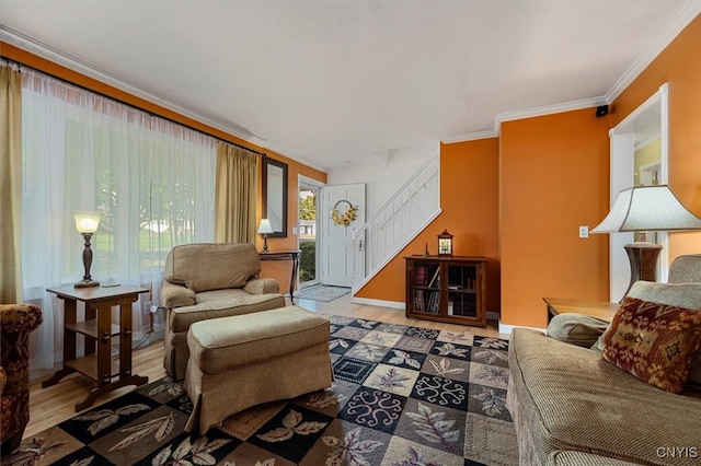 living room with crown molding and hardwood / wood-style flooring