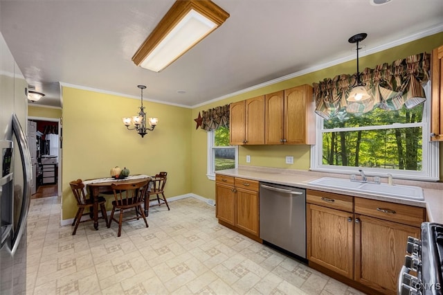 kitchen with hanging light fixtures, range, dishwasher, crown molding, and sink