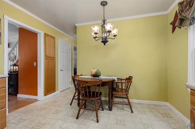 dining area featuring an inviting chandelier and crown molding