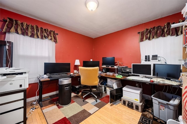 office with light wood-type flooring