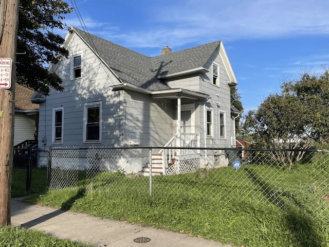 view of side of property featuring a yard