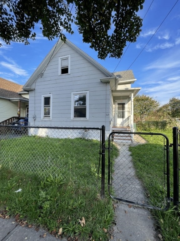 view of side of property with a yard