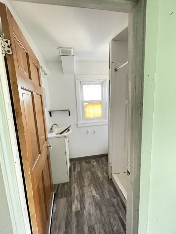 bathroom featuring vanity and hardwood / wood-style flooring