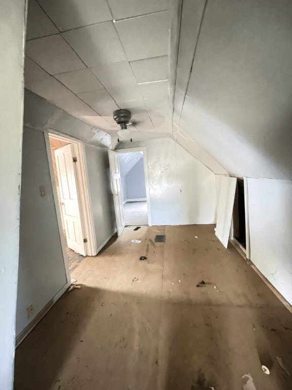 bonus room with lofted ceiling and ceiling fan