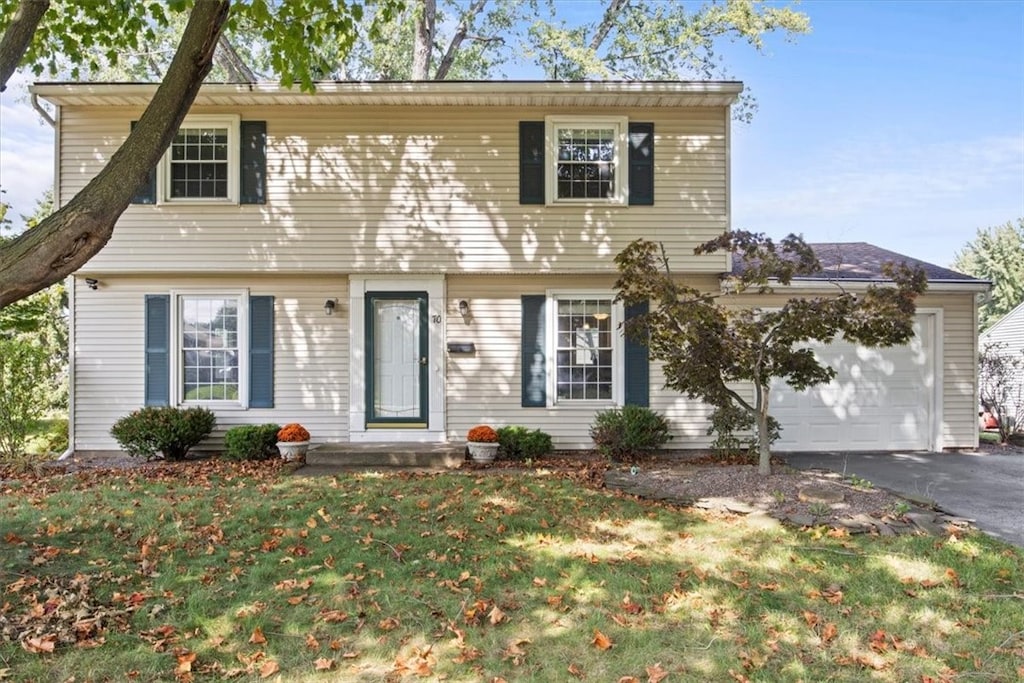 view of front facade with a front lawn and a garage