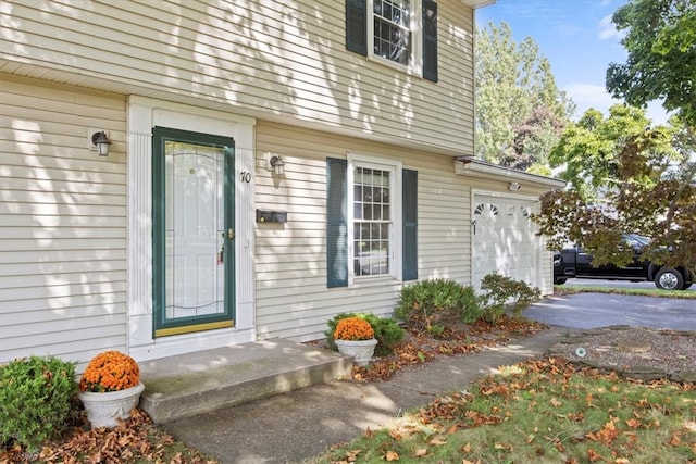 view of exterior entry featuring a garage