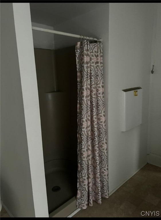 bathroom with a shower with curtain